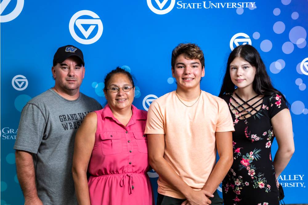 Student with family at orientation welcome